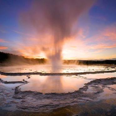 WY Yellowstone geyser sunset.jpg